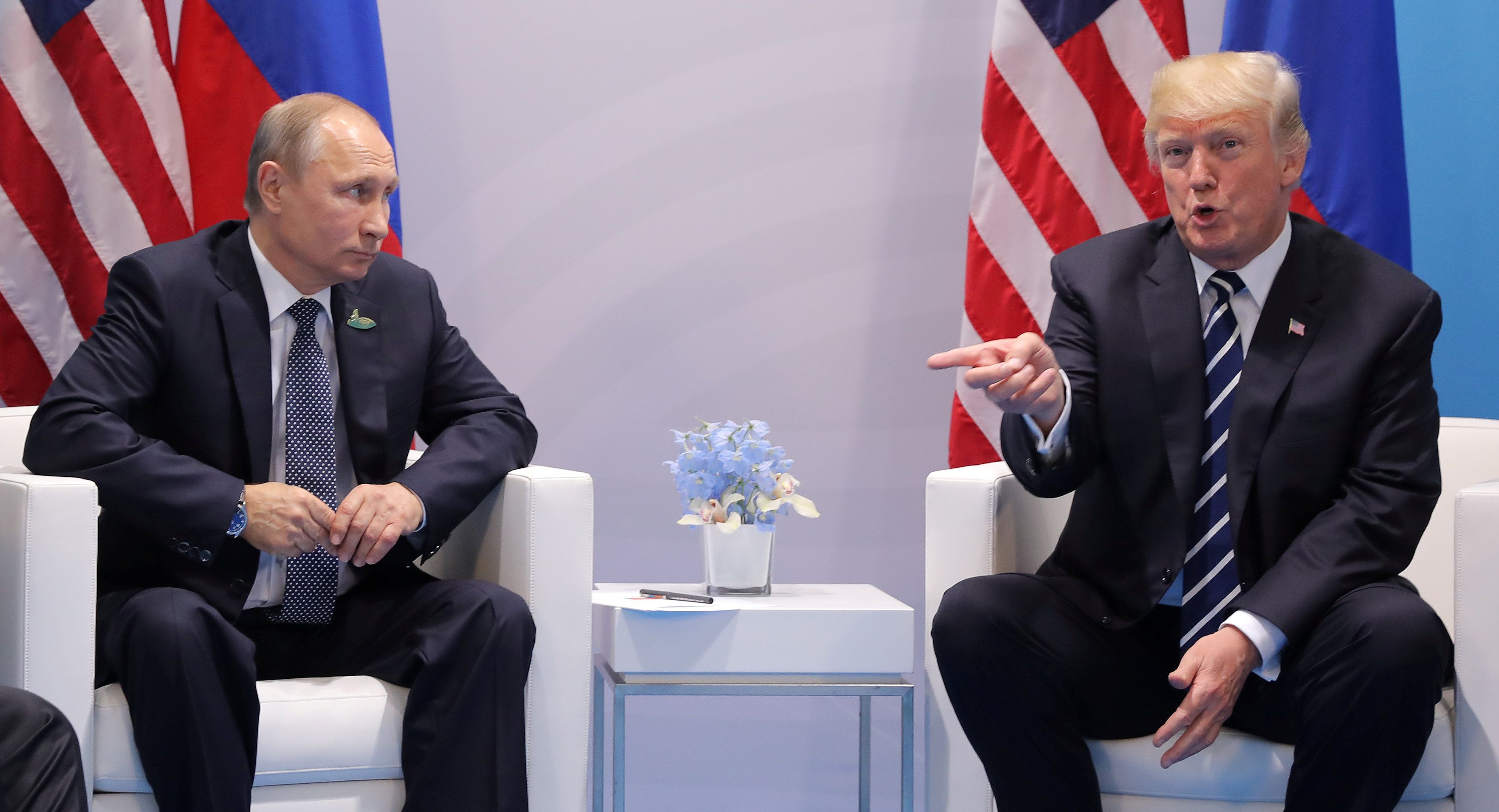 U.S. President Donald Trump gestures as he meets with Russian President Vladimir Putin during their bilateral meeting at the G20 summit in Hamburg
