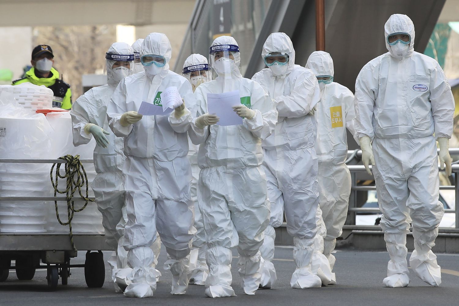 Medical staff members arrive for a duty shift at Dongsan Hospital in Daegu, South Korea, Tuesday, March 24, 2020. For most people, the new coronavirus causes only mild or moderate symptoms, such as fever and cough. For some, especially older adults and people with existing health problems, it can cause more severe illness, including pneumonia.(Han Jong-chan/Yonhap via AP) Medical staff members arrive for a duty shift at Dongsan Hospital in Daegu, South Korea, Tuesday, March 24, 2020. For most people, the new coronavirus causes only mild or moderate symptoms, such as fever and cough. For some, especially older adults and people with existing health problems, it can cause more severe illness, including pneumonia.(Han Jong-chan/Yonhap via AP)