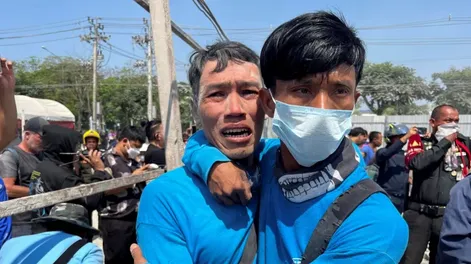 Workers react near a site of a collapsed building after the tremors of a strong earthquake that struck central Myanmar on Friday affected Bangkok, Thailand, March 28, 2025. REUTERS/Ann Wang