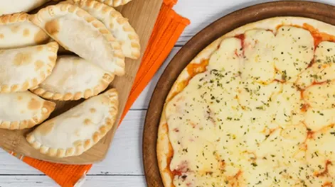 Con promos y descuentos, lanzaron “La noche de la pizza y la empanada” en todo el país