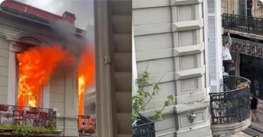 Dramático escape de un incendio en un edificio: una vecina quedó colgando de un cable