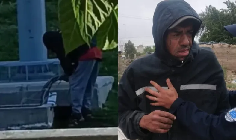 El detenido mientras robaba los cables.-